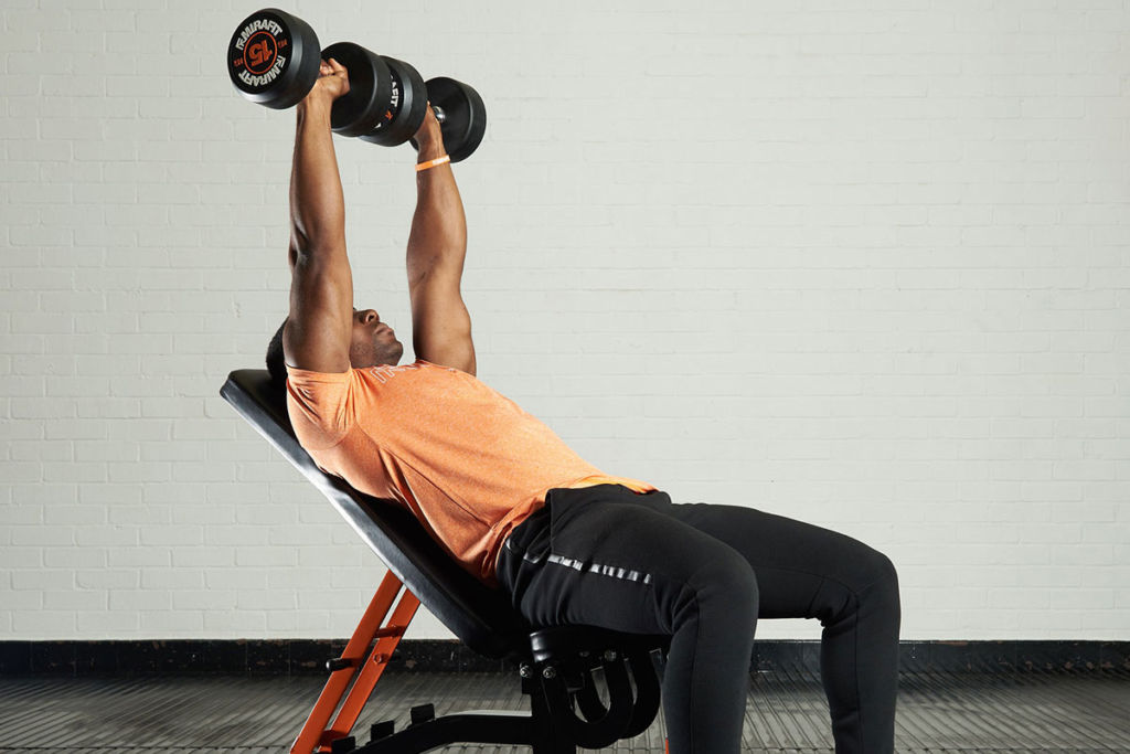 fitness expert on a mirafit weight bench doing incline dumbbell press